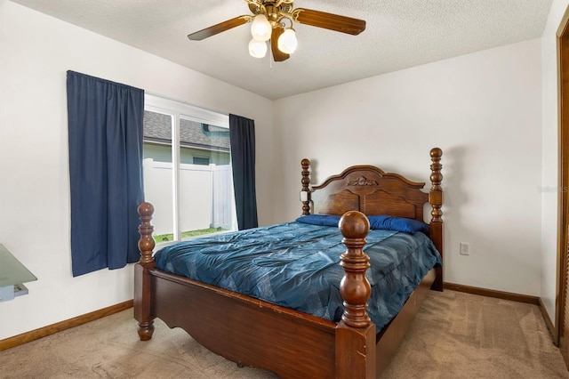 704 Butternut Pl, Lakeland, FL 33813 - bedroom with carpet flooring, a ceiling fan, and a textured ceiling