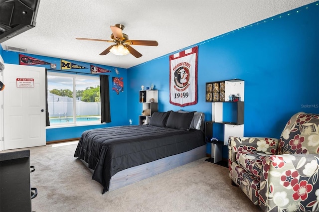 704 Butternut Pl, Lakeland, FL 33813 - bedroom with carpet flooring, a textured ceiling, ceiling fan, and access to outside