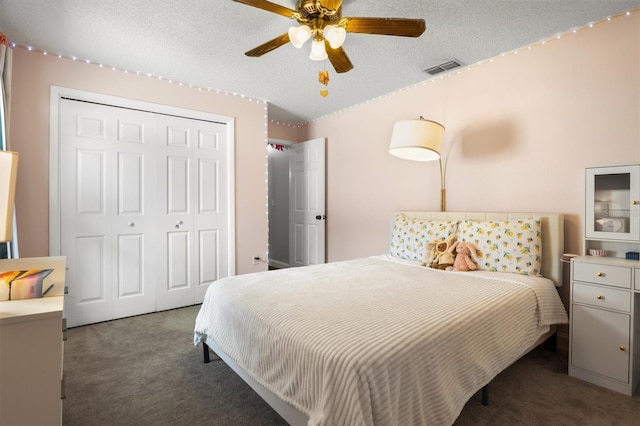 704 Butternut Pl, Lakeland, FL 33813 - bedroom with carpet floors, a closet, a textured ceiling, and a ceiling fan
