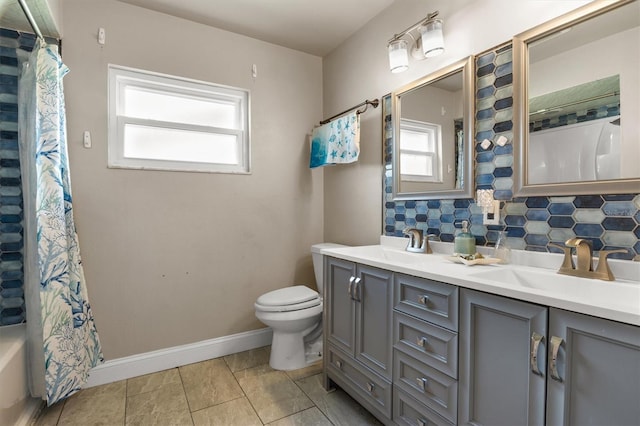 704 Butternut Pl, Lakeland, FL 33813 - full bath with tasteful backsplash, double vanity, shower / tub combo with curtain, and tile patterned floors