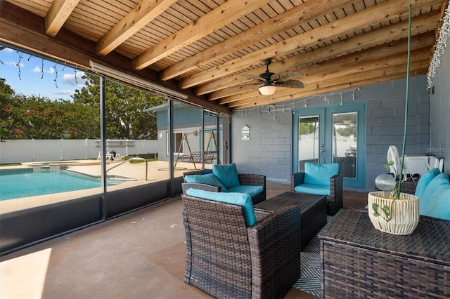 704 Butternut Pl, Lakeland, FL 33813 - fenced backyard with french doors, a patio area, ceiling fan, and an outdoor hangout area