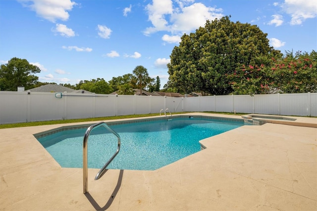 704 Butternut Pl, Lakeland, FL 33813 - view of swimming pool featuring a patio area, a fenced backyard, and a pool with connected hot tub