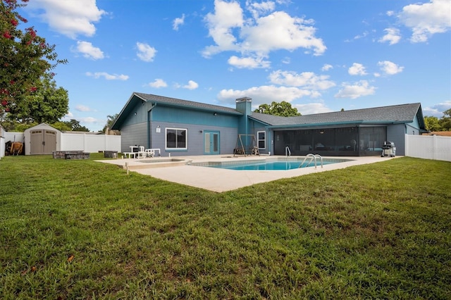 704 Butternut Pl, Lakeland, FL 33813 - back of house with a storage shed, a sunroom, a fenced backyard, a patio area, and a chimney