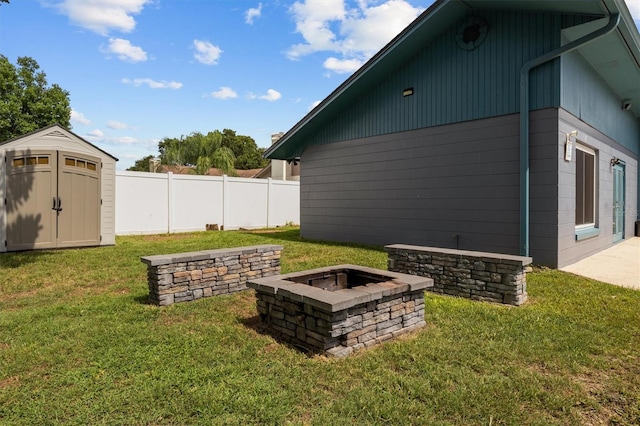 704 Butternut Pl, Lakeland, FL 33813 - view of yard featuring a fire pit and a storage shed