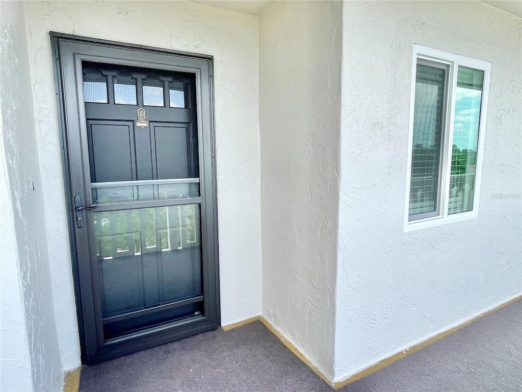 1776 6th St NW Unit 709, Winter Haven, FL 33881 - view of exterior entry with stucco siding