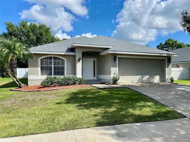1790 Turtle Rock Dr, Lakeland, FL 33803 - ranch-style home featuring stucco siding, a garage, driveway, and a shingled roof