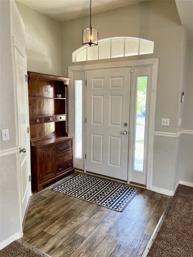 1790 Turtle Rock Dr, Lakeland, FL 33803 - entryway with dark wood-style flooring and baseboards