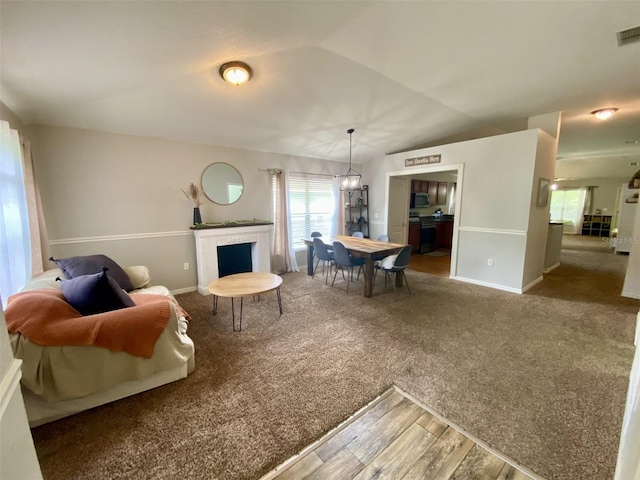 1790 Turtle Rock Dr, Lakeland, FL 33803 - carpeted living room with plenty of natural light, wood finished floors, and a fireplace