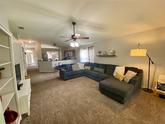 1790 Turtle Rock Dr, Lakeland, FL 33803 - living room with carpet, a ceiling fan, and vaulted ceiling