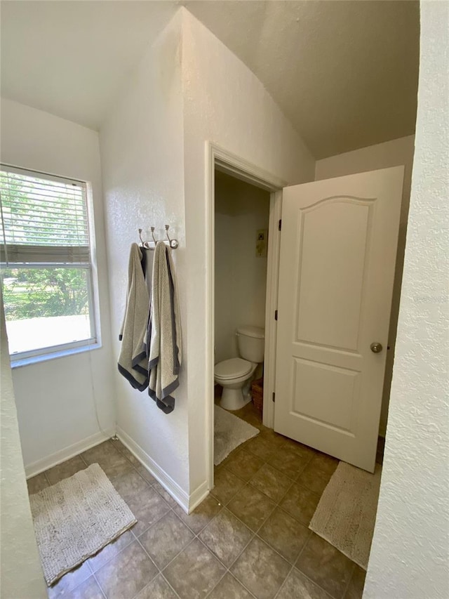 1790 Turtle Rock Dr, Lakeland, FL 33803 - bathroom featuring tile patterned flooring and lofted ceiling