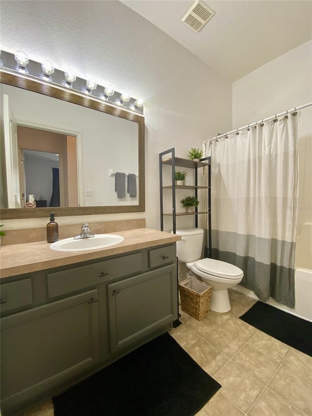 1790 Turtle Rock Dr, Lakeland, FL 33803 - full bath featuring vanity, tile patterned flooring, and shower / bath combo with shower curtain
