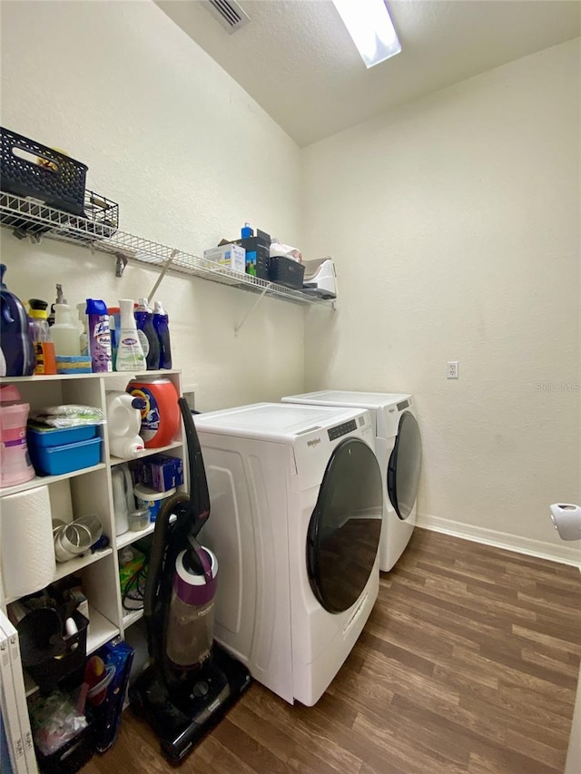 1790 Turtle Rock Dr, Lakeland, FL 33803 - laundry area featuring washer and dryer and wood finished floors