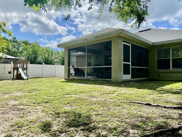 1790 Turtle Rock Dr, Lakeland, FL 33803 - view of yard featuring a sunroom, a playground, and a ceiling fan