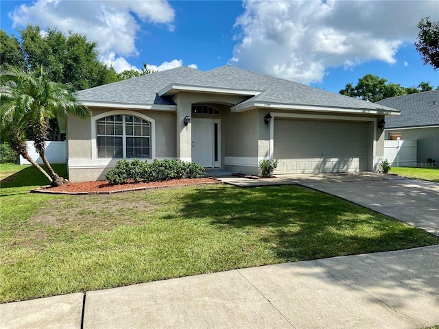 1790 Turtle Rock Dr, Lakeland, FL 33803 - single story home with stucco siding, an attached garage, driveway, and a shingled roof