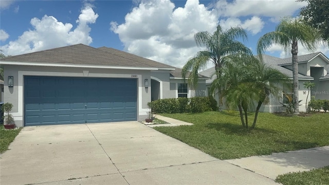 13443 Graham Yarden Dr, Riverview, FL 33579 - ranch-style house featuring stucco siding, driveway, an attached garage, and a front yard