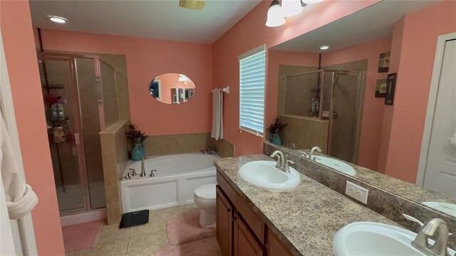 13443 Graham Yarden Dr, Riverview, FL 33579 - full bathroom featuring a stall shower, a bath, double vanity, and tile patterned flooring