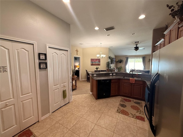 13443 Graham Yarden Dr, Riverview, FL 33579 - kitchen featuring freestanding refrigerator, dishwasher, a peninsula, light carpet, and light tile patterned floors