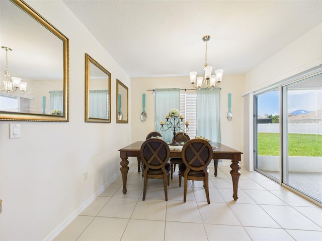 5751 Lakeside Landings Blvd, Winter Haven, FL 33881 - dining space with a chandelier and light tile patterned floors
