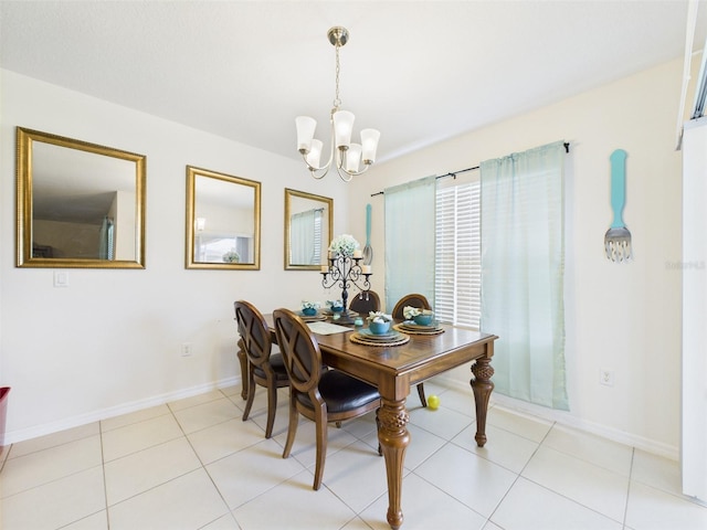 5751 Lakeside Landings Blvd, Winter Haven, FL 33881 - dining area featuring a chandelier and light tile patterned flooring