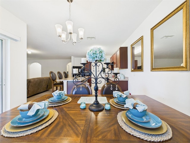 5751 Lakeside Landings Blvd, Winter Haven, FL 33881 - dining area featuring a chandelier