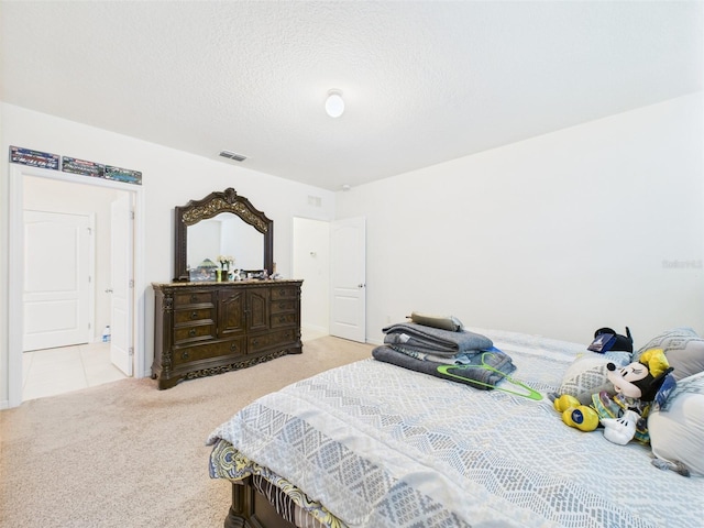 5751 Lakeside Landings Blvd, Winter Haven, FL 33881 - bedroom with carpet and a textured ceiling