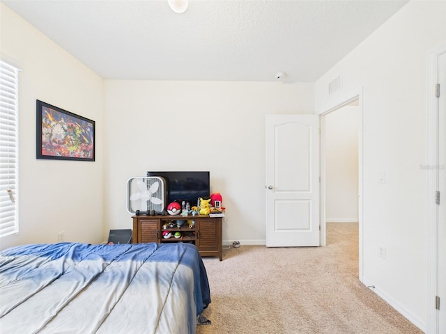 5751 Lakeside Landings Blvd, Winter Haven, FL 33881 - bedroom featuring light carpet and baseboards