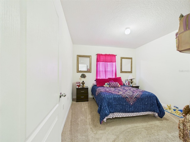 5751 Lakeside Landings Blvd, Winter Haven, FL 33881 - bedroom featuring carpet floors and a textured ceiling