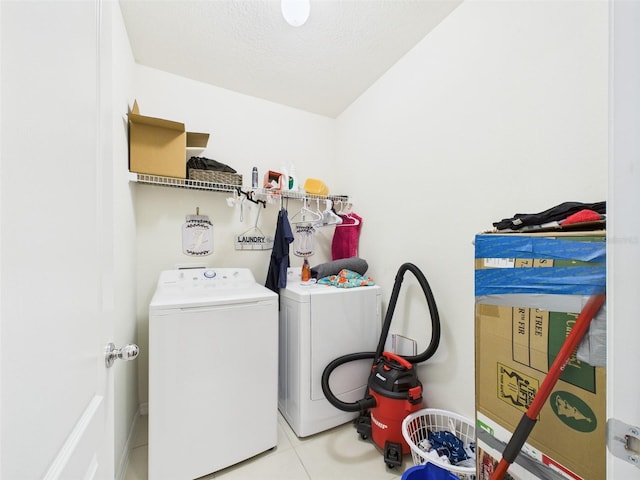 5751 Lakeside Landings Blvd, Winter Haven, FL 33881 - washroom with washer and clothes dryer and tile patterned flooring