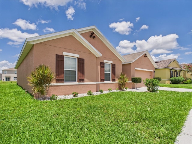 5751 Lakeside Landings Blvd, Winter Haven, FL 33881 - single story home with stucco siding, an attached garage, concrete driveway, and a front lawn
