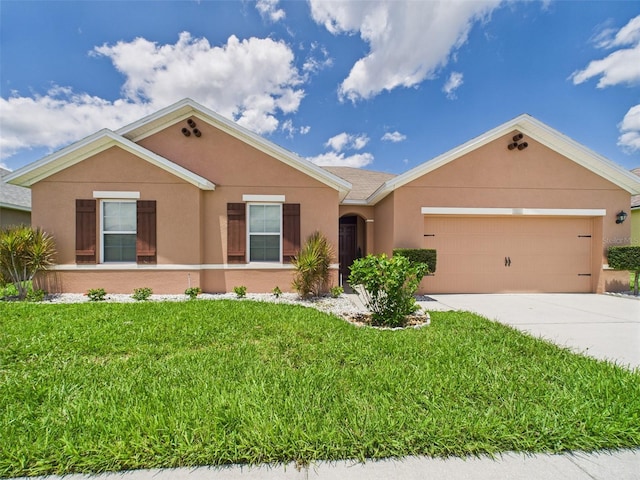 5751 Lakeside Landings Blvd, Winter Haven, FL 33881 - ranch-style home with stucco siding, an attached garage, concrete driveway, and a front yard