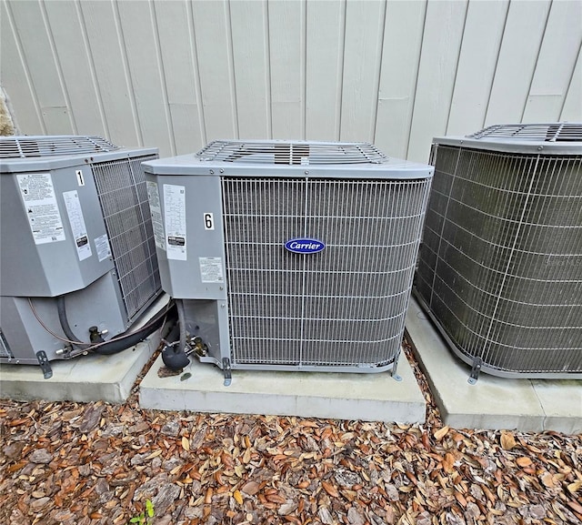 816 Pinewood Ct Unit 3126, Haines City, FL 33844 - exterior view of a central AC unit and board and batten siding