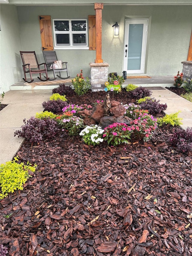 106 Corbett Rd, Lithia, FL 33547 - view of exterior entry with a porch and stucco siding