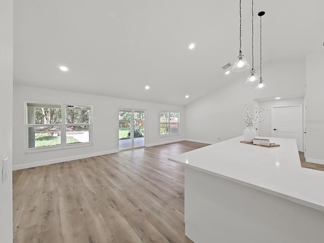 106 Corbett Rd, Lithia, FL 33547 - unfurnished living room featuring light wood-style floors, recessed lighting, and vaulted ceiling