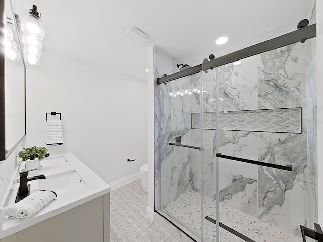 106 Corbett Rd, Lithia, FL 33547 - bathroom with a marble finish shower, double vanity, and recessed lighting