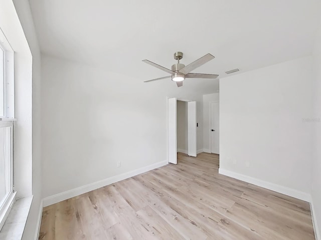 106 Corbett Rd, Lithia, FL 33547 - unfurnished room with light wood-style floors and ceiling fan