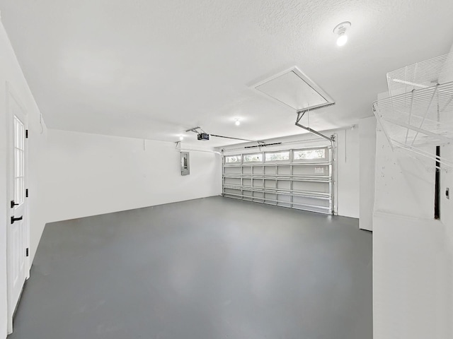 106 Corbett Rd, Lithia, FL 33547 - garage featuring electric panel and a garage door opener
