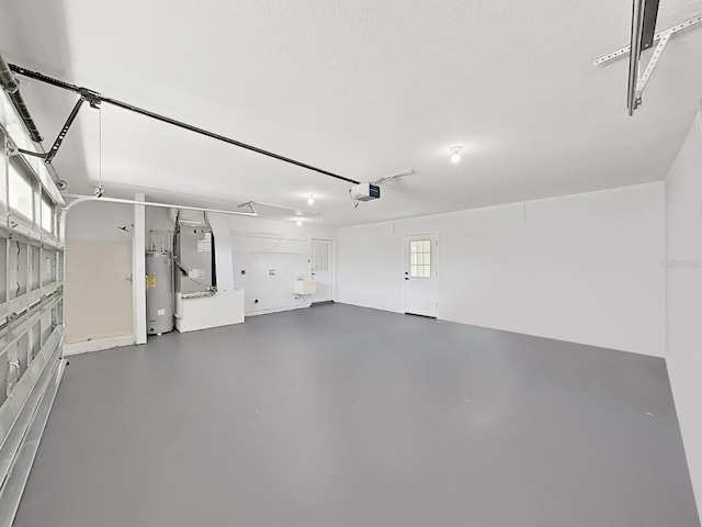 106 Corbett Rd, Lithia, FL 33547 - garage featuring a garage door opener, heating unit, and water heater