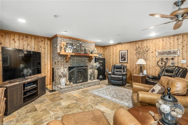 479 State Road 64 E, Zolfo Springs, FL 33890 - living area featuring wooden walls, recessed lighting, ceiling fan, stone finish floors, and crown molding