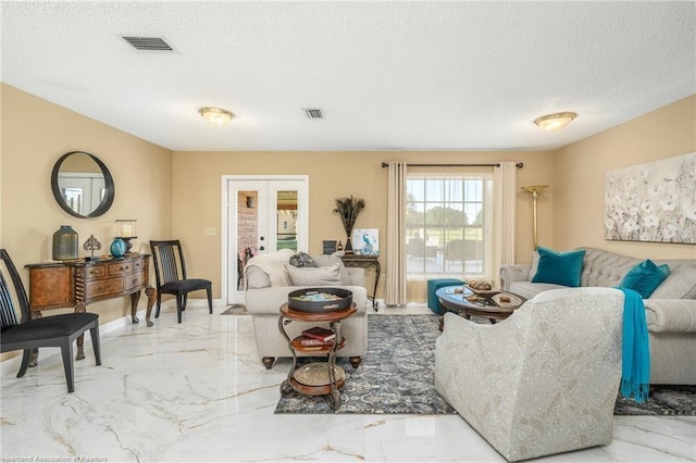 479 State Road 64 E, Zolfo Springs, FL 33890 - living area with marble tiled floors, french doors, and a textured ceiling