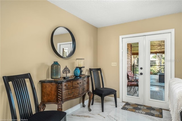 479 State Road 64 E, Zolfo Springs, FL 33890 - entryway featuring french doors, marble look tiles, and a textured ceiling