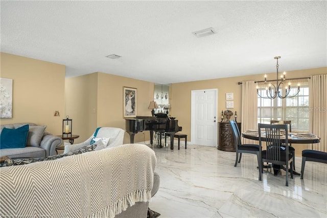 479 State Road 64 E, Zolfo Springs, FL 33890 - living area featuring a chandelier, light marble finish floors, and a textured ceiling