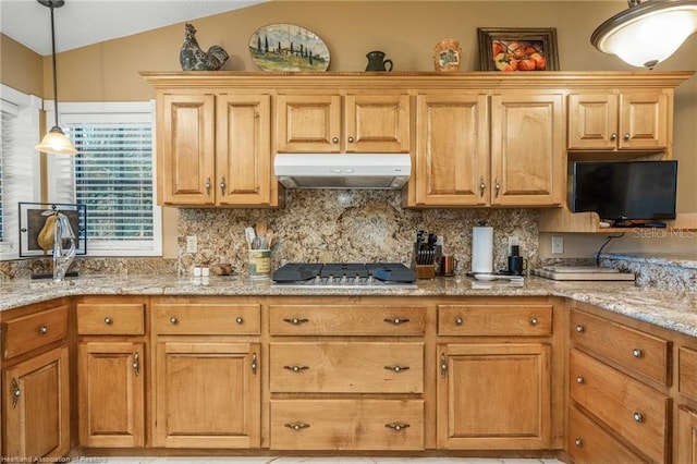 479 State Road 64 E, Zolfo Springs, FL 33890 - kitchen with under cabinet range hood, tasteful backsplash, stainless steel gas stovetop, pendant lighting, and vaulted ceiling