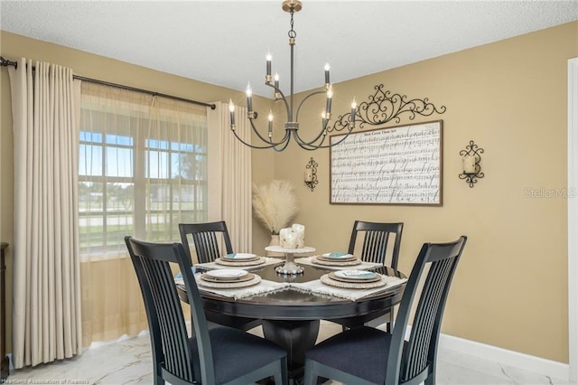 479 State Road 64 E, Zolfo Springs, FL 33890 - dining room featuring light marble finish floors, a chandelier, and healthy amount of natural light