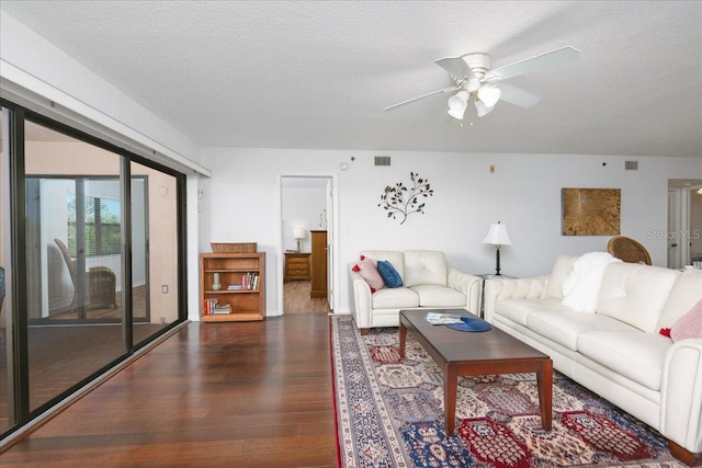 23465 Harborview Rd Unit 223, Punta Gorda, FL 33980 - living area with dark wood finished floors, a ceiling fan, and a textured ceiling