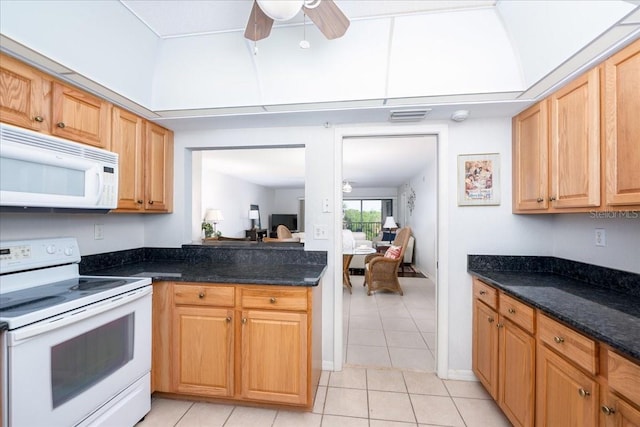 23465 Harborview Rd Unit 223, Punta Gorda, FL 33980 - kitchen featuring white appliances, light tile patterned floors, a ceiling fan, and dark stone countertops