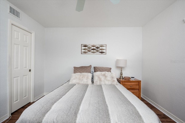 23465 Harborview Rd Unit 223, Punta Gorda, FL 33980 - bedroom with dark wood finished floors and a ceiling fan