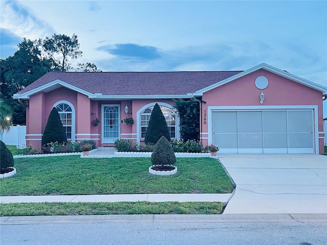 1366 Merrimack Pl, Davenport, FL 33837 - single story home featuring concrete driveway, an attached garage, and stucco siding