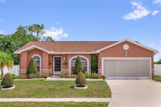 1366 Merrimack Pl, Davenport, FL 33837 - single story home with concrete driveway, stucco siding, and an attached garage