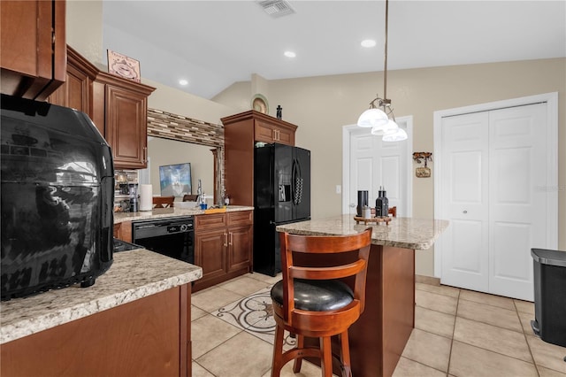 1366 Merrimack Pl, Davenport, FL 33837 - kitchen with black appliances, a kitchen island, light tile patterned flooring, vaulted ceiling, and pendant lighting