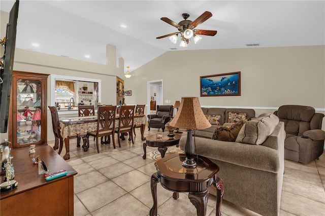 1366 Merrimack Pl, Davenport, FL 33837 - living room with lofted ceiling, light tile patterned floors, and a ceiling fan